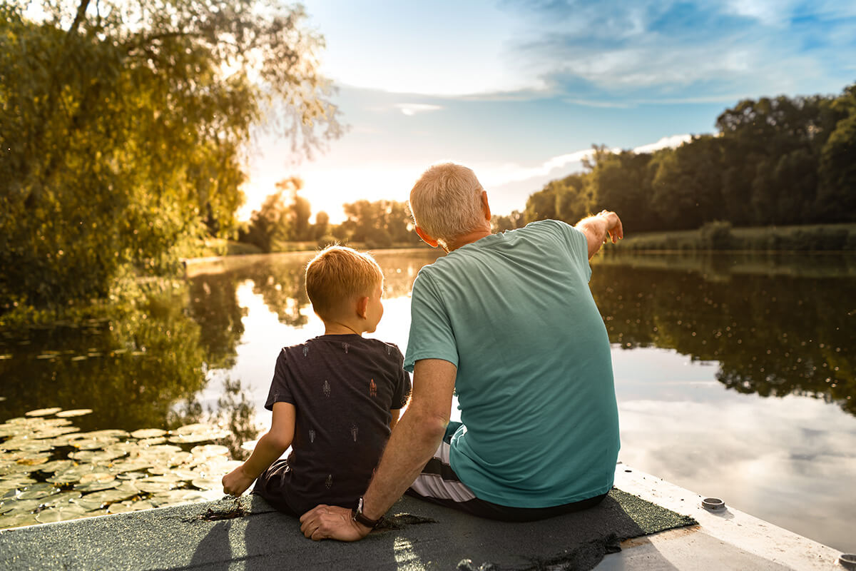 Man and boy admiring lake in Austin Texas